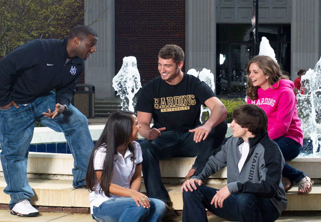 Students talking near fountain